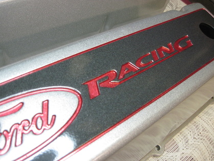Big block Ford Racing valve covers in Alien Silver, Wilder Red, Ironsides II, and clear